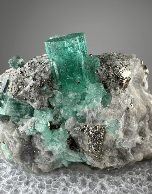 Beryl var. Emerald, Calcite, Pyrite